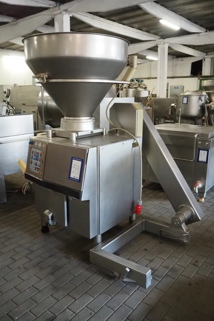 Handtmann vacuum filling machine with lifter for 2