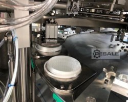 Maschine: GRUNWALD Rotary 12.000E/1-/2-b Becherfüll- und Verschliessmaschinen