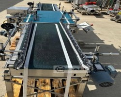 Maschine:   Gebindedrehstation mit Gurtbandfördern